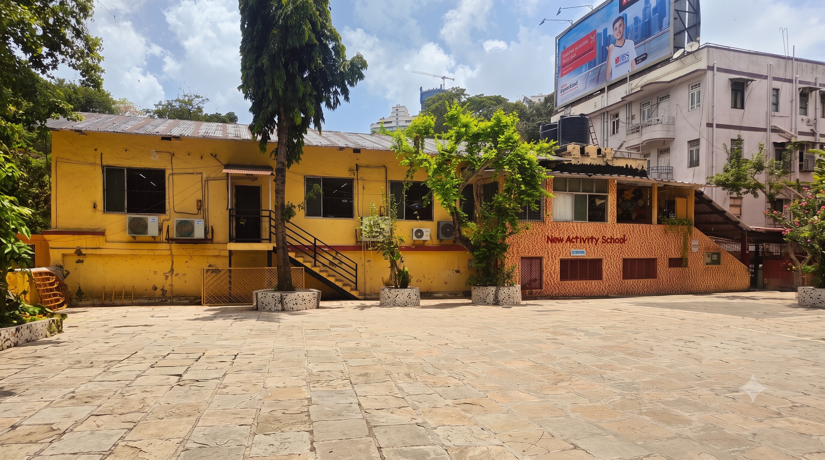 The same New Activity School courtyard today, empty in the morning light